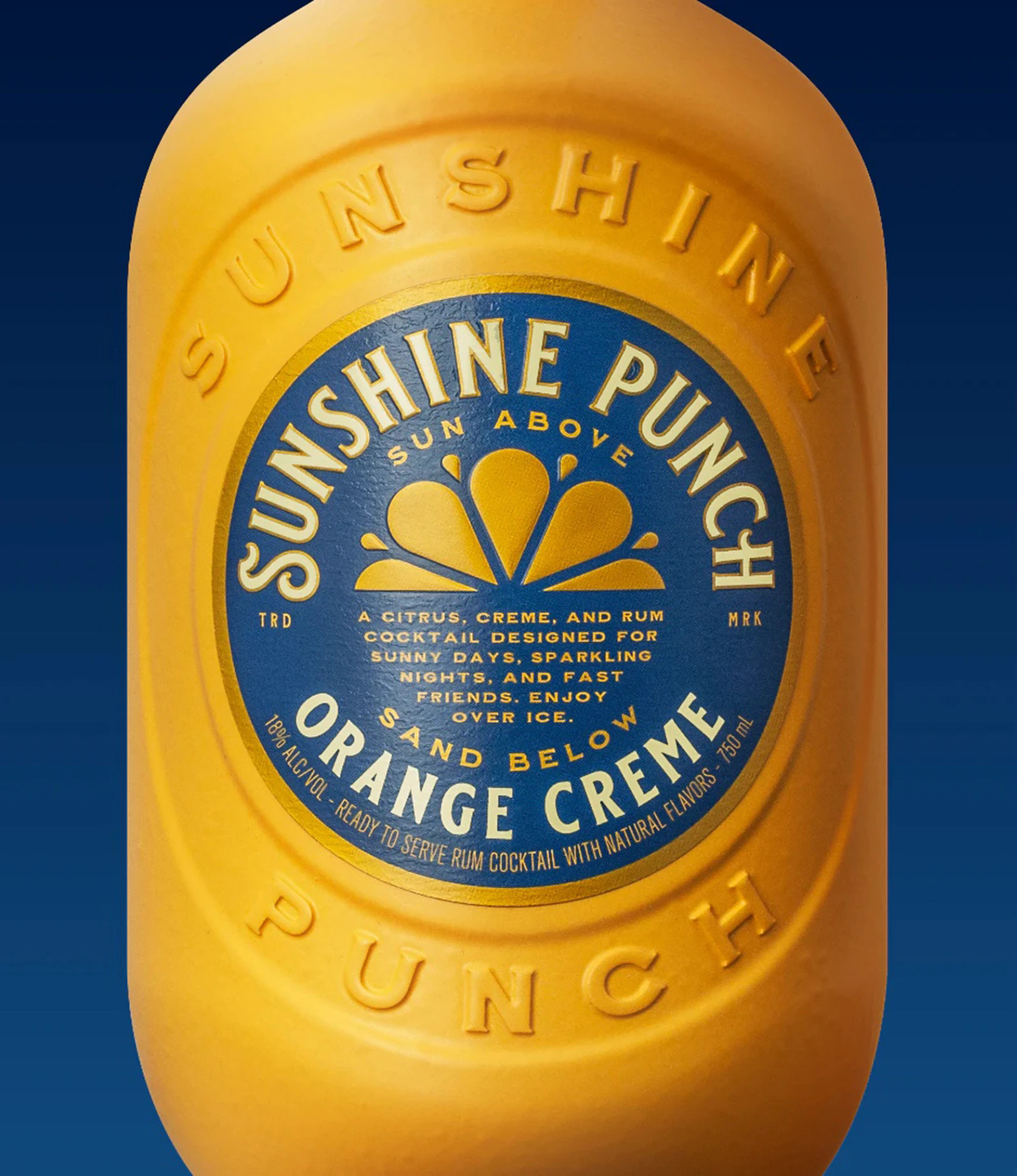 Closeup of orange and blue label on Sunshine Punch Orange Creme cocktail bottle on a blue background
